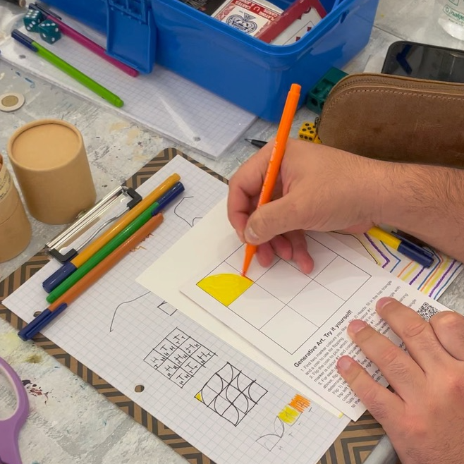 Participants working on generative art at a workshop session